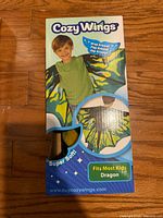 Front of Cozy Wings box showing dragon design and product details