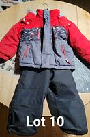 Front view of jacket and pants laid flat