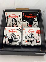 Display box containing four board books with finger puppets