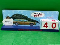 Front view of calendar showing car graphic, speech bubble, both number blocks reading 40