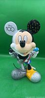 Front view of Mickey Mouse figurine showing "Disney 100" ear and colour pattern