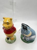 Front view of both shakers showing character design and color