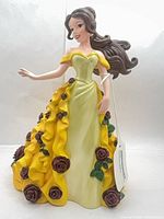 Front view of Belle figurine showing gown and roses
