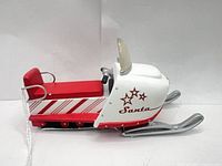 Left side view showing overall design and candy-cane stripes