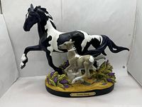 Full view of figurine showing mare, foal and base