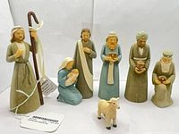 Full set of seven figurines displayed