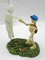 Full view showing skeleton mail carrier and ghost on base