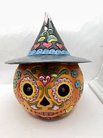 Front view of Jim Shore Day of the Dead jack-o-lantern figurine
