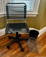 Front view of Euro Style bungie cord office chair with baskets and trash bin