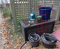 Overall lot with deck box, tomato cages, buckets, and accessories