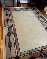 Full view of Shaw Olefin area rug on hardwood floor
