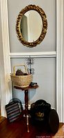 Overall lot showing mirror, table, knitting basket with yarn, jewelry tree, mesh bag, hat box