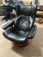 Front view of black leather Ekornes Stressless recliner