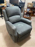 Front angled view of gray fabric recliner showing overall design and upholstery
