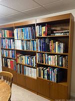 Front view of full wall unit with shelves and base cabinets
