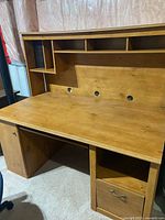 Front view of desk with hutch showing overall structure and drawer