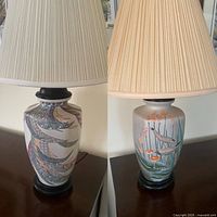 Both ceramic lamps side by side with shades