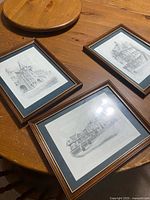 All three framed prints on table