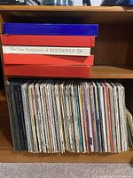 Shelf showing two red box sets, Beethoven symphonies set, and row of LP spines