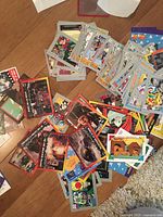 Mixed piles of trading cards on floor