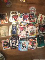 Spread of stacked hockey cards displaying various players, teams and brands
