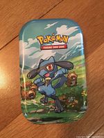 Riolu Pokémon Trading Card Game mini tin lid showing artwork