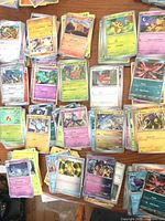 Stacks and spread of multicoloured Pokémon cards