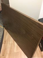 Front view of dark wood desktop panel