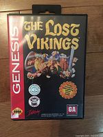 Front of The Lost Vikings Sega Genesis case showing title art and rating