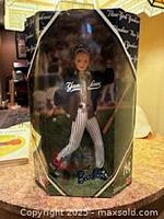 Front view of boxed Barbie showing uniform and packaging