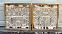 Two framed macrame panels side by side