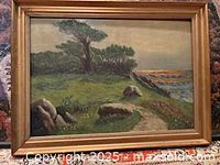 Full view of framed landscape oil painting