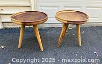 Both round wooden side tables front view