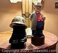 Both ceramic decanters displayed together