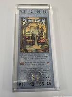 Front view of encased ticket showing Super Bowl artwork and seat information