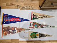 Group shot of all five pennants on white background