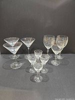 All ten clear glass stemware pieces grouped together