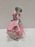 Front view of Royal Doulton figurine showing full attire