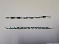 Both bracelets laid flat showing full length