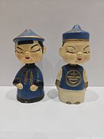 Front view of both nodder figurines showing overall design and paint