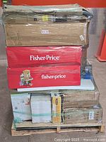 Front view of pallet with red Fisher-Price boxes and various cartons