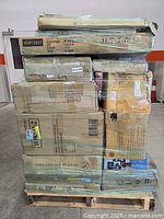 Front view of shrink-wrapped pallet displaying stacked cartons with various product codes
