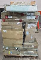 Front view of shrink-wrapped pallet with stacked furniture boxes