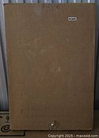 Front view of sealed cardboard box containing the Easy Track RS1600 Series shoe shelf