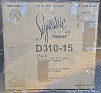 Front view of boxed table showing model number D310-15 and taped areas