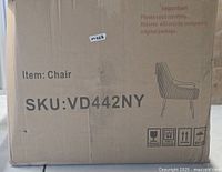 Sealed shipping carton marked Item: Chair, SKU: VD442NY, lot sticker m028 visible
