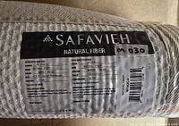 Safavieh label on rolled rug showing brand and series