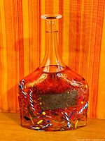 Full view of hand-blown art glass bottle front