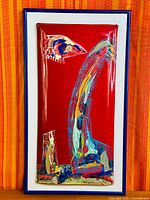 Full view of framed enamel artwork