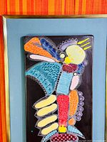 Upper section of enamel panel highlighting signature area and colours